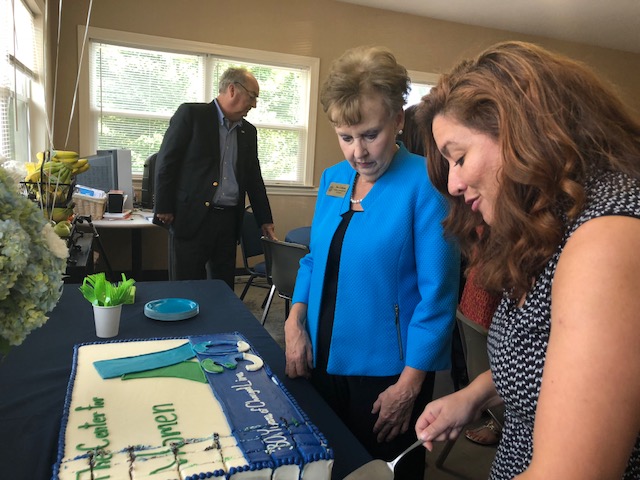 County Commissioner at Large Pat Cotham helps Center for Women Director, Delilah Montalvo cut the cake at the Center's 30th Anniversary Celebration.